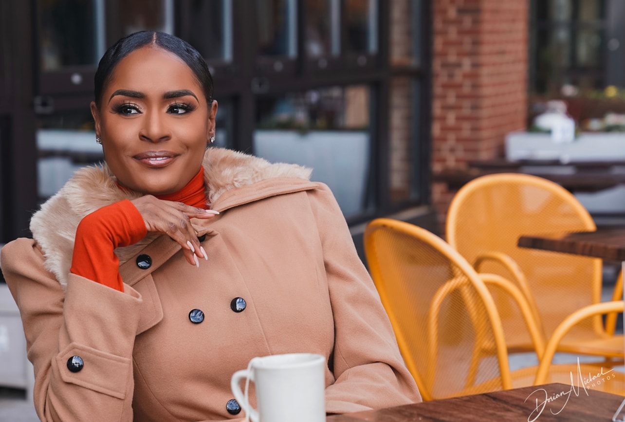 Aubree Bravo — camel coat, orange turtleneck